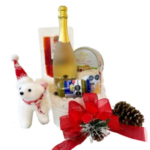Canasta navideña gourmet Regalo Feliz con vino espumante, jamón serrano, queso tres leches, galletas Tivoli y salsa pesto